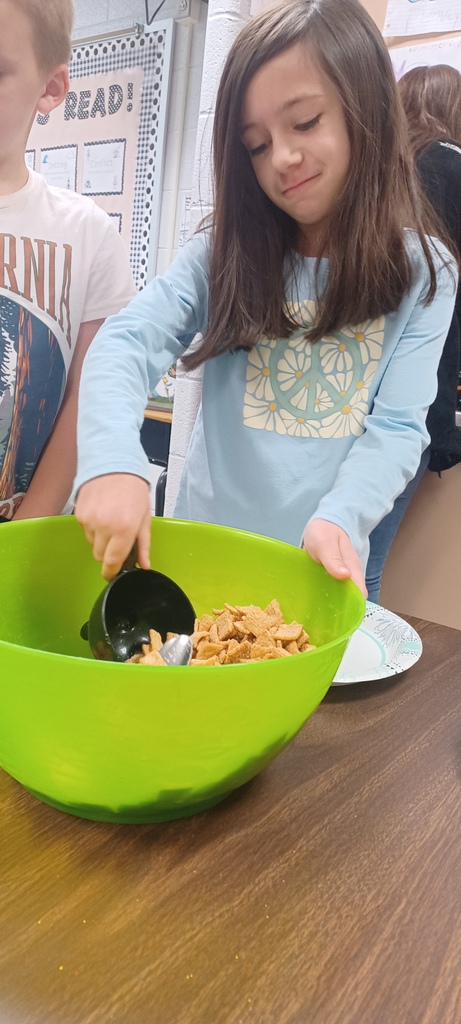 Several third grade classes watched The Charlie Brown Thanksgiving and then used measurement skills to create Snoopy’s recipe for Thanksgiving,  which includes jelly beans, toast, popcorn, and pretzels. Pictured are Ms. Ciccarone's class enjoying a yummy math class!