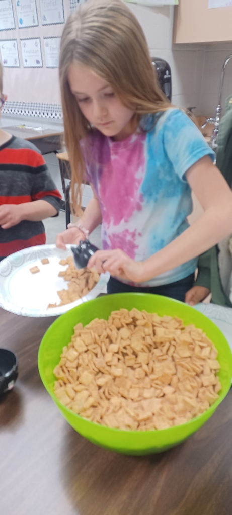 Several third grade classes watched The Charlie Brown Thanksgiving and then used measurement skills to create Snoopy’s recipe for Thanksgiving,  which includes jelly beans, toast, popcorn, and pretzels. Pictured are Ms. Ciccarone's class enjoying a yummy math class!