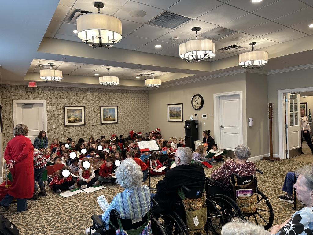 AGR music teacher Mr. Gibson, fresh off last night's evening holiday concert, brought the well-prepared 2nd Grade to The Culpeper to sing Christmas carols to residents, who greatly appreciated and enjoyed seeing and hearing the students sing.  After, Mrs. White's class posed with her father who is a resident.  Thanks for spreading Christmas cheer!