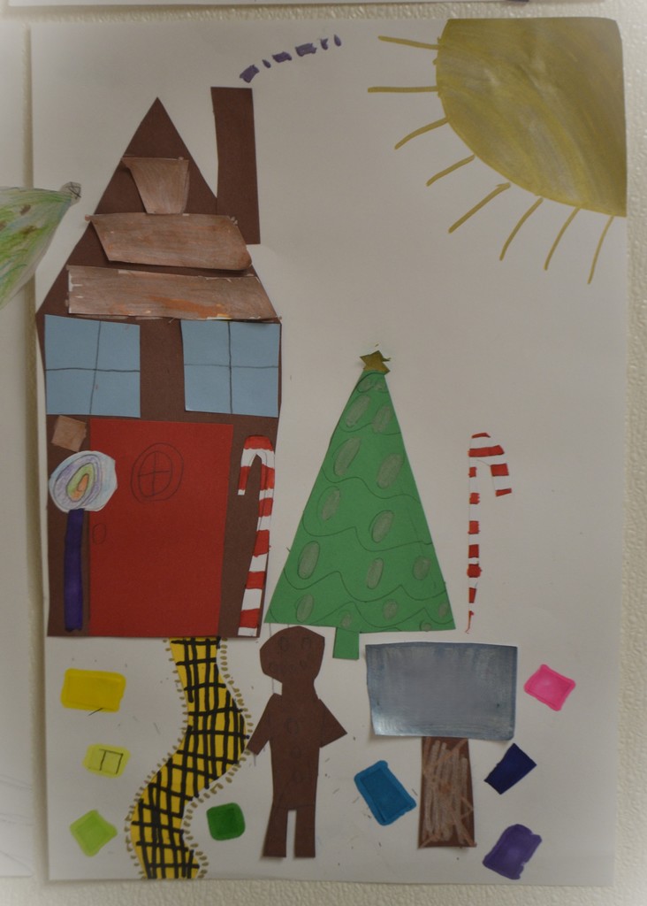 A colorful example of the Gingerbread Math House created by a student.  Artwork is festive with a variety of bright colors.