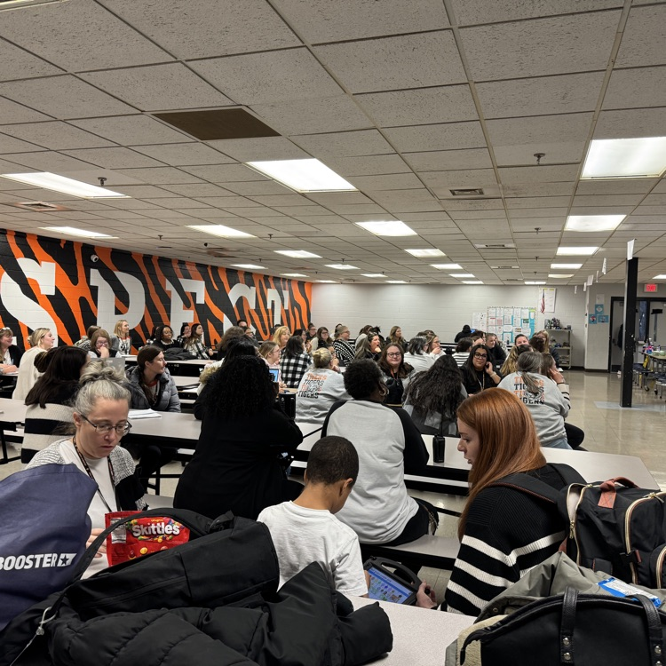 teacher is wearing black and white