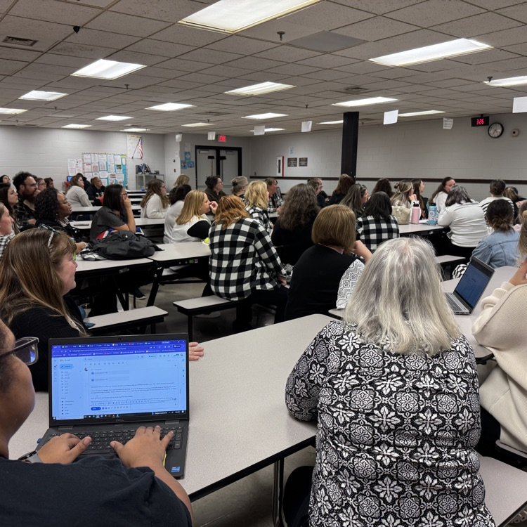 Teacher is wearing black and white