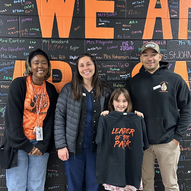 girl, her parents, and her teacher