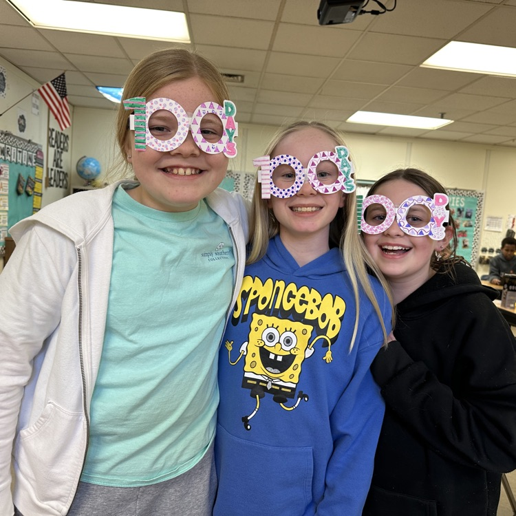three girls wearing 100th day glasses