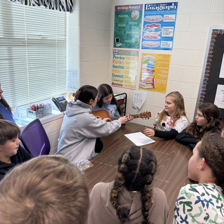 Ms. High brought in her guitar to demonstrate how the strings make different pitches to 5th graders in Mrs. Day's class!