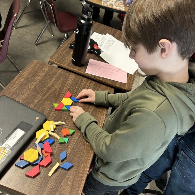 Meanwhile, 5th graders in Mr. Hallett’s class worked to create a pattern block design with a value of $100 in honor of the 100th day of school!