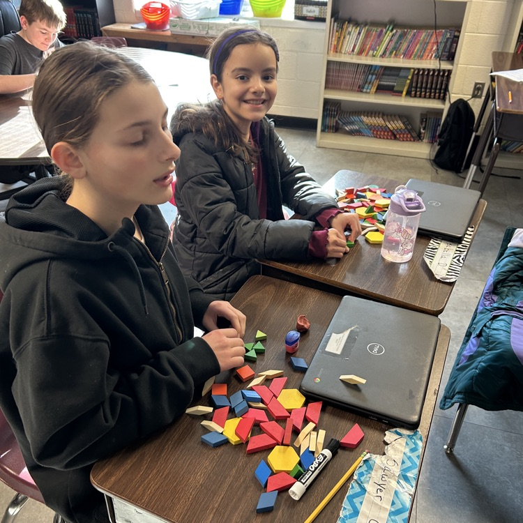 Meanwhile, 5th graders in Mr. Hallett’s class worked to create a pattern block design with a value of $100 in honor of the 100th day of school!