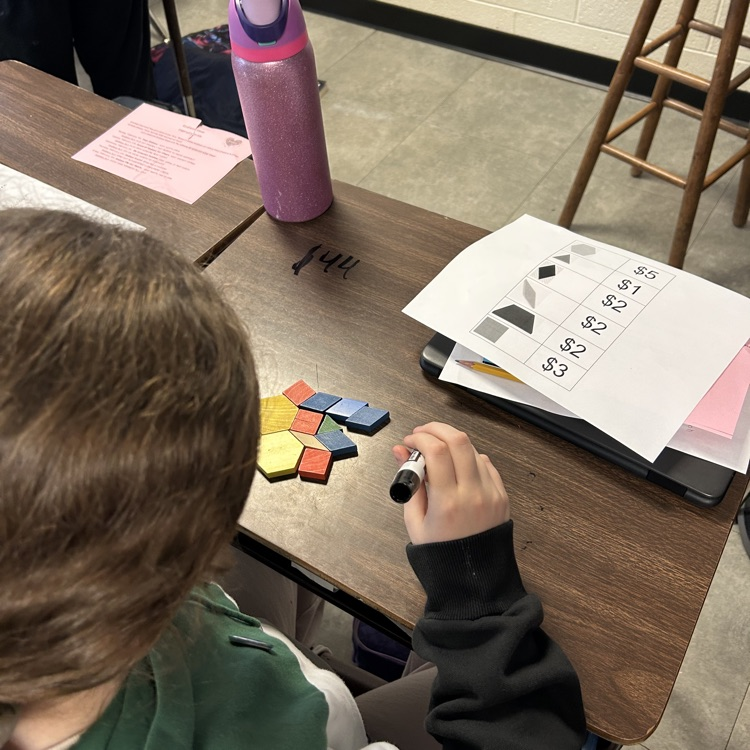 Meanwhile, 5th graders in Mr. Hallett’s class worked to create a pattern block design with a value of $100 in honor of the 100th day of school!
