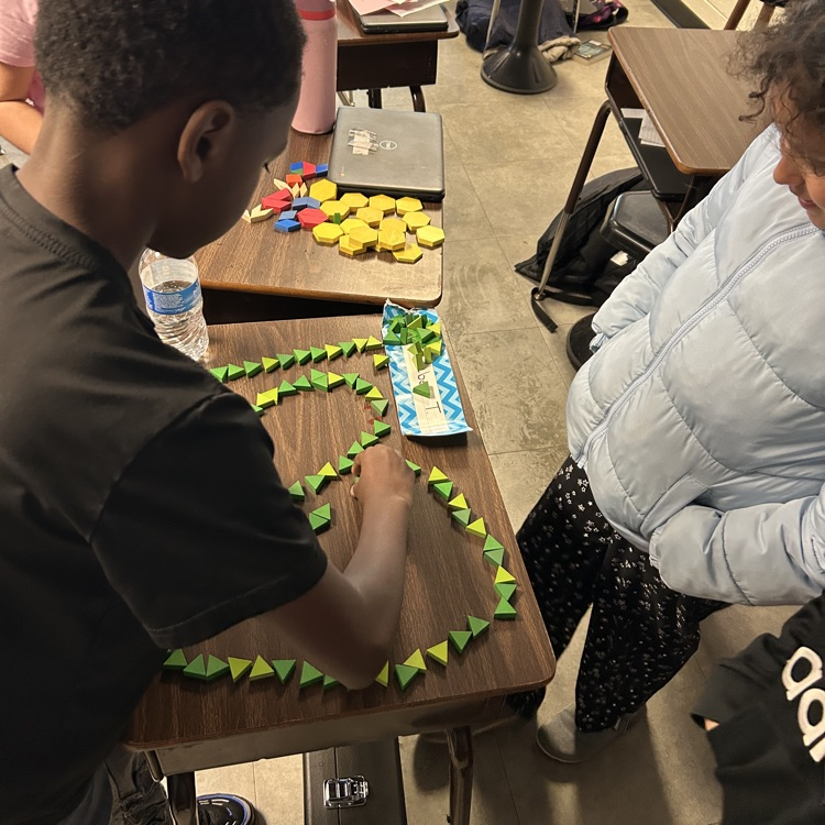 Meanwhile, 5th graders in Mr. Hallett’s class worked to create a pattern block design with a value of $100 in honor of the 100th day of school!