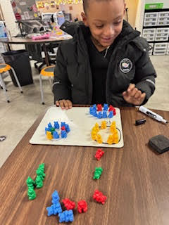 Mrs. Childress’s first grade class realized after midterm testing that grouping tens and ones can be a tricky concept, so they took some time for a throwback review to strengthen their understanding.