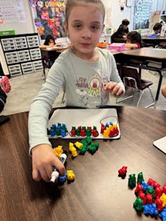 Mrs. Childress’s first grade class realized after midterm testing that grouping tens and ones can be a tricky concept, so they took some time for a throwback review to strengthen their understanding.