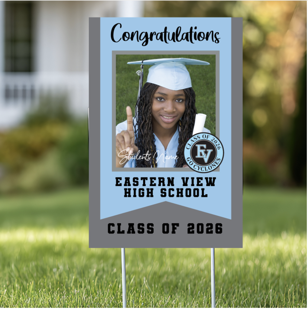 A graduation yard sign is displayed on a green lawn with a softly blurred house and trees in the background. The sign is rectangular and mounted on two thin metal stakes pushed into the grass. The sign features school colors of light blue, gray, and black. At the top, in large black script lettering, it says “Congratulations.” Centered on the sign is a portrait of a smiling graduate wearing a light blue cap and gown. The graduate is holding a rolled diploma in one hand and raising their index finger on the other hand in a “number one” gesture. The background of the portrait is green grass. Over the lower part of the photo, in a white script font, it says “Student’s Name.” To the right side of the photo is a circular badge that reads “Class of 2026” and “Go Cyclones,” with the letters “EV” in the center. Below the photo, in bold black block letters, it reads: “EASTERN VIEW HIGH SCHOOL” At the bottom of the sign, in large black block letters, it says: “CLASS OF 2026.” The overall design is clean and celebratory, clearly intended to honor a graduating senior from Eastern View High School’s Class of 2026.