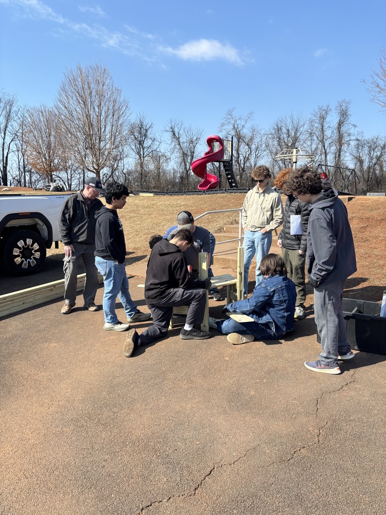 Today, AGR Alumni Ben Tomblin (son of AGR staff's Mrs. Tomblin), as part of his Eagle Scout project and with much help from his troop, built three circular benches on the Grade 2nd-5th playground. These were needed for students and staff, and will certainly get lots of use.  Thanks so much Ben and his Boy Scout troop!