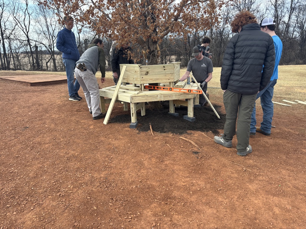 Today, AGR Alumni Ben Tomblin (son of AGR staff's Mrs. Tomblin), as part of his Eagle Scout project and with much help from his troop, built three circular benches on the Grade 2nd-5th playground. These were needed for students and staff, and will certainly get lots of use.  Thanks so much Ben and his Boy Scout troop!