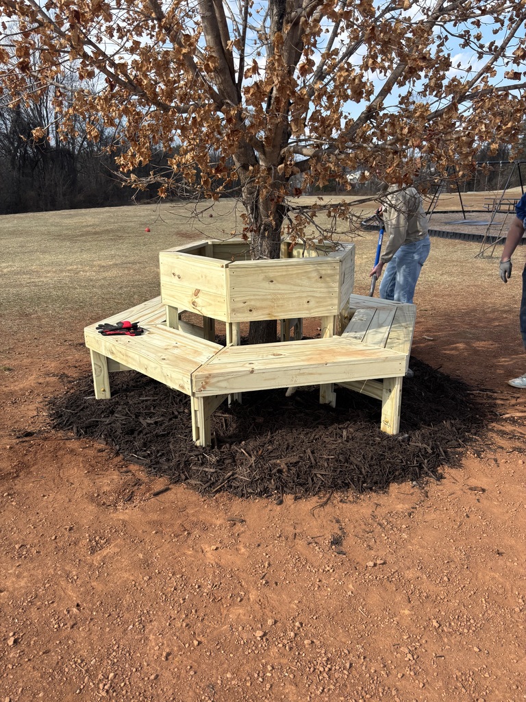 Today, AGR Alumni Ben Tomblin (son of AGR staff's Mrs. Tomblin), as part of his Eagle Scout project and with much help from his troop, built three circular benches on the Grade 2nd-5th playground. These were needed for students and staff, and will certainly get lots of use.  Thanks so much Ben and his Boy Scout troop!