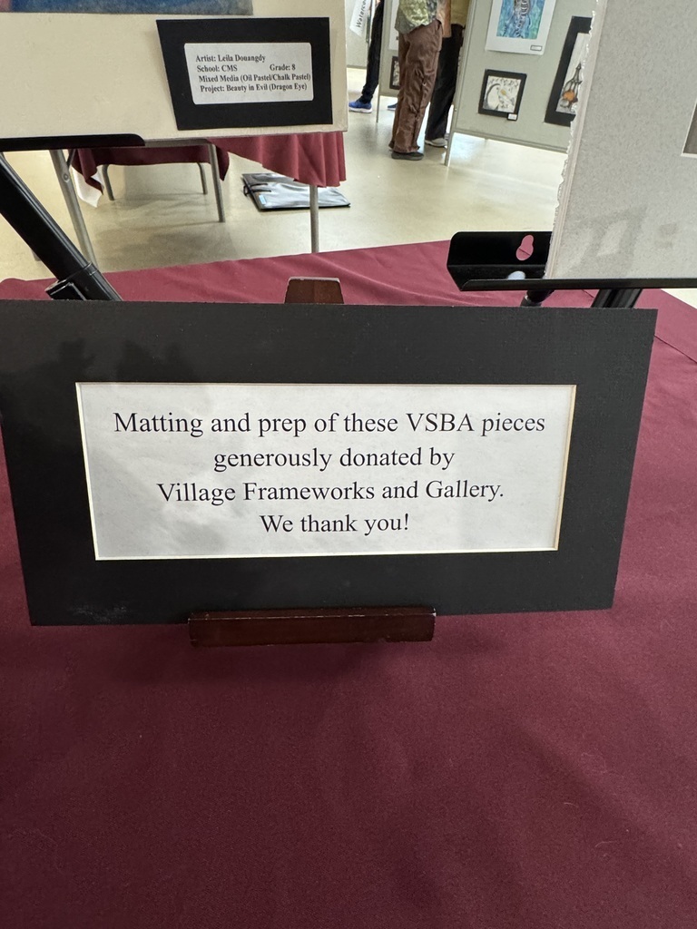 a sign that says Matting and prep of these VSBA pieces generously donated by Village Frameworks and Gallery.  We thank you.