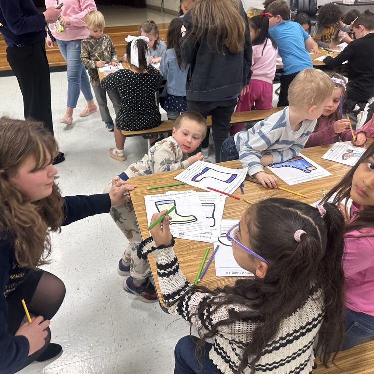 students pictured coloring pictures of different kinds of cowboy boots 