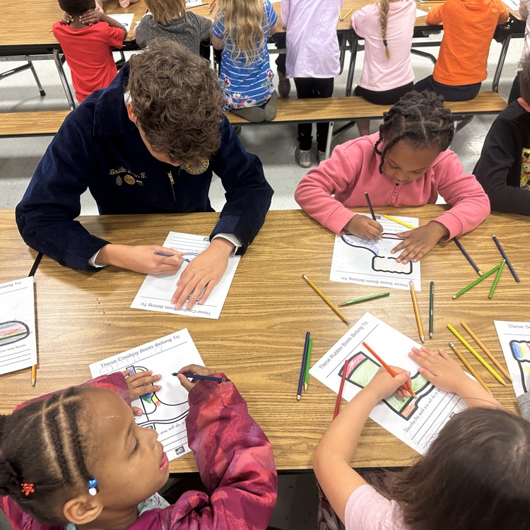 students pictured coloring pictures of different kinds of cowboy boots 