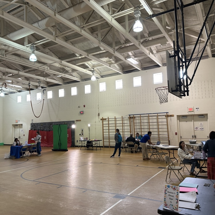 Picture showing a gymnasium with tables set up to complete kindergarten registration. Please call 540-825-0616 for any questions.