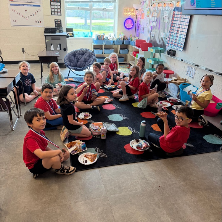 book it winner group sitting on carpet 