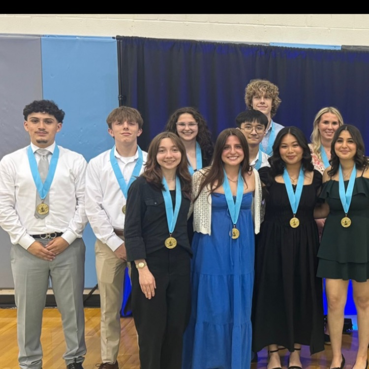20 students gather for a celebratory photo celebrating their accomplishment as the Top 20