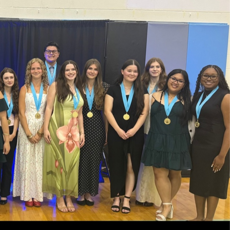 20 students gather for a celebratory photo celebrating their accomplishment as the Top 20