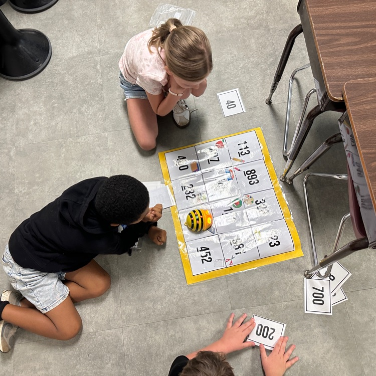 Mrs. Sink's third graders were the first ones to use bee bots this year, showing what they know with place value and coding skills!  #hustleandheartsetusapart
