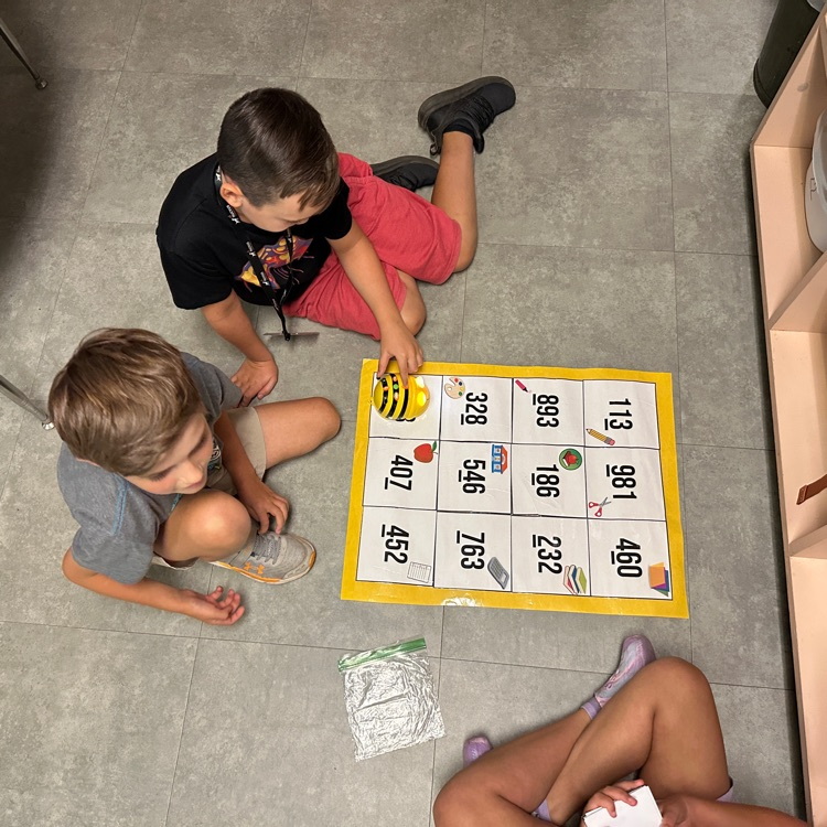 Mrs. Sink's third graders were the first ones to use bee bots this year, showing what they know with place value and coding skills!  #hustleandheartsetusapart