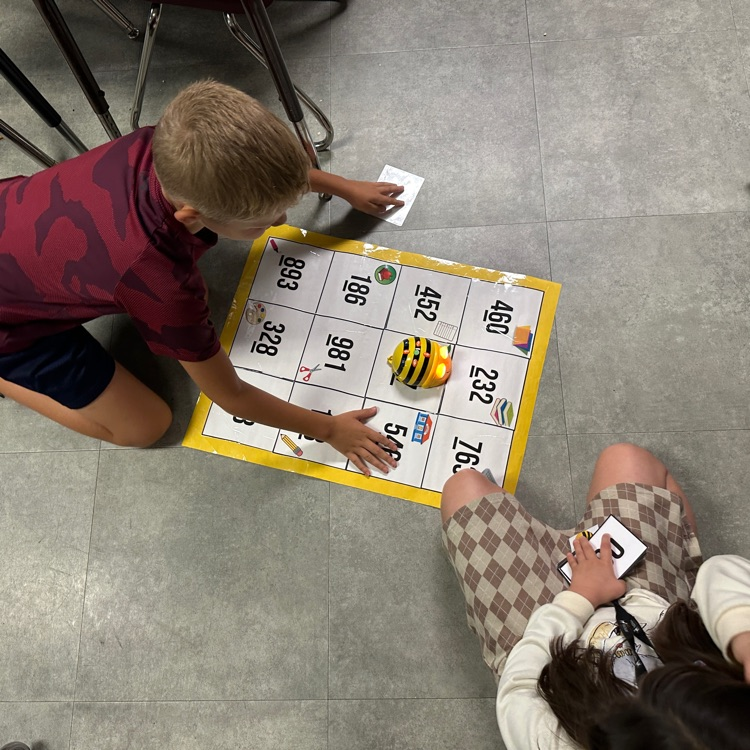 Mrs. Sink's third graders were the first ones to use bee bots this year, showing what they know with place value and coding skills!  #hustleandheartsetusapart
