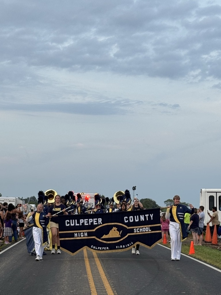 Marching Band with flag that reads Culpeper County High School