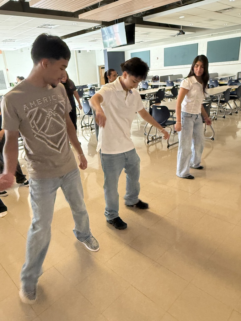 3 students dancing