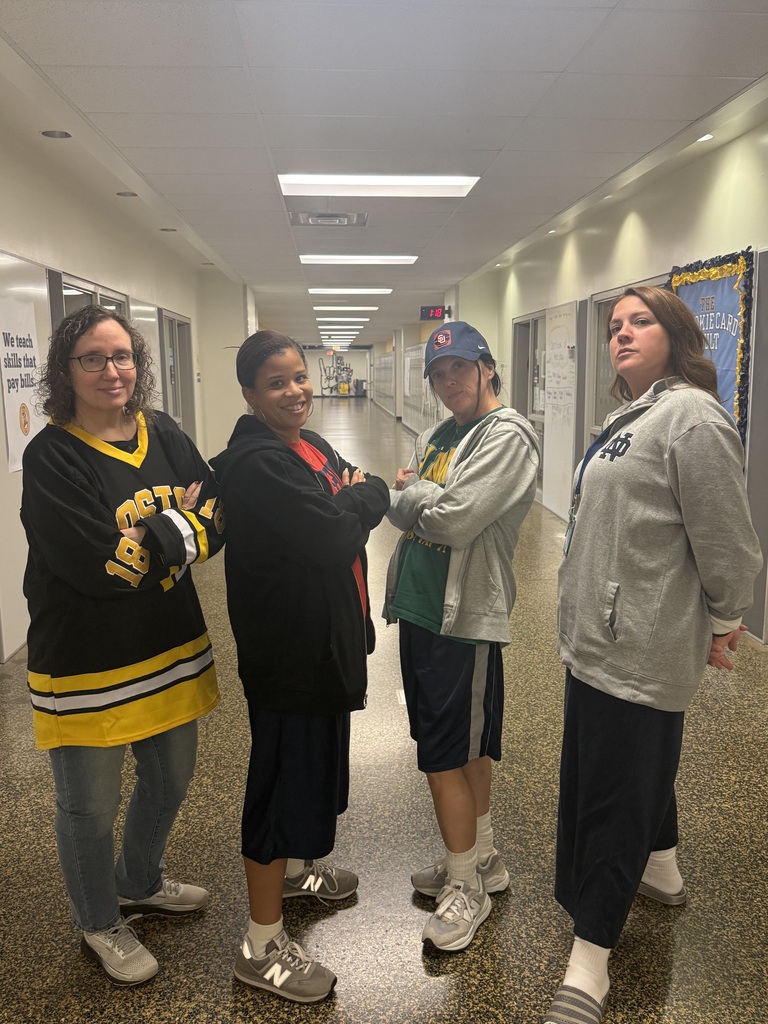 4 staff dressed in baggy clothes