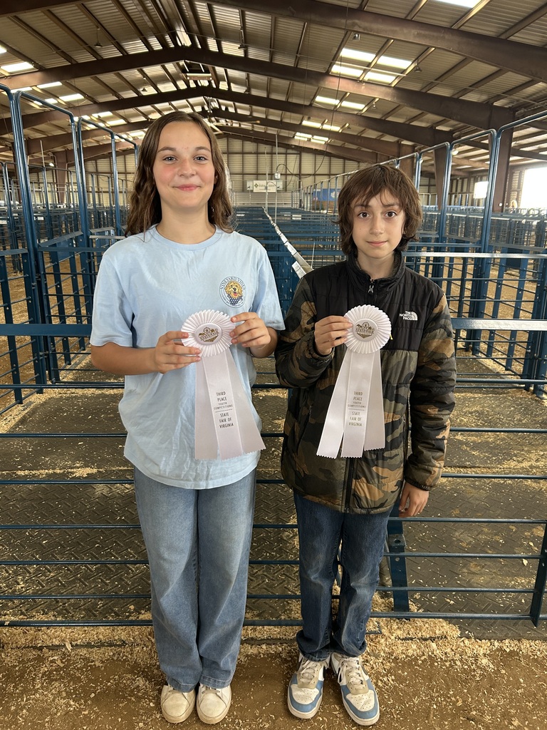 Two CMS FFA students proudly hold third-place ribbons earned during competition at the State Fair of Virginia.