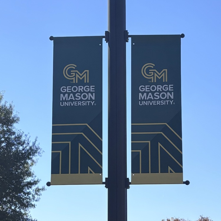 Two vertical banners attached to a post. Banners feature "GM" and "GEORGE MASON UNIVERSITY" in gold.