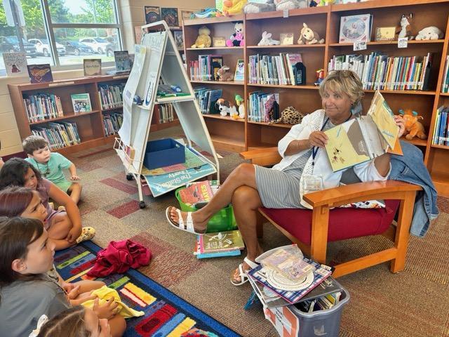 In this picture, Ms Zuna, our librarian shows a book that has been ripped and torn.