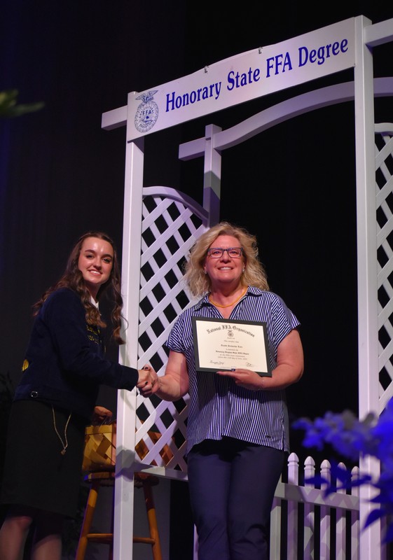 CCPS Career and Technical Education Director Randi Richards-Lutz receives the Virginia Honorary State FFA Degree on stage during the 99th Virginia FFA State Convention, June 2025