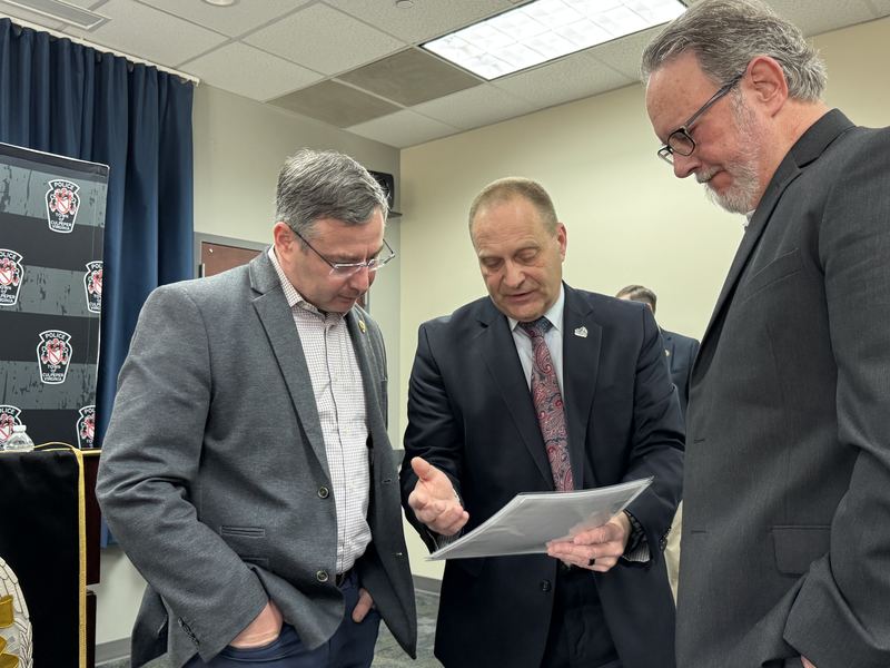 Congressman Eugene Vindman speaks with local officials while reviewing project documents during the Community Project Funding announcement at the Culpeper Police Department Community Room on February 27, 2026.