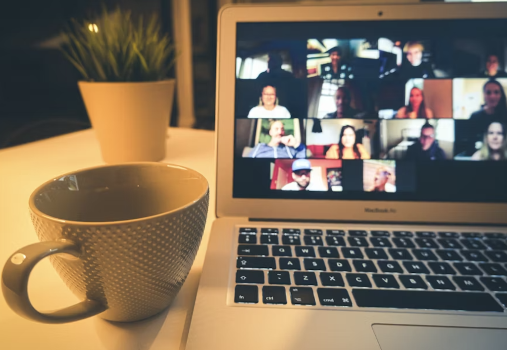 image of laptop meeting and cup of coffee