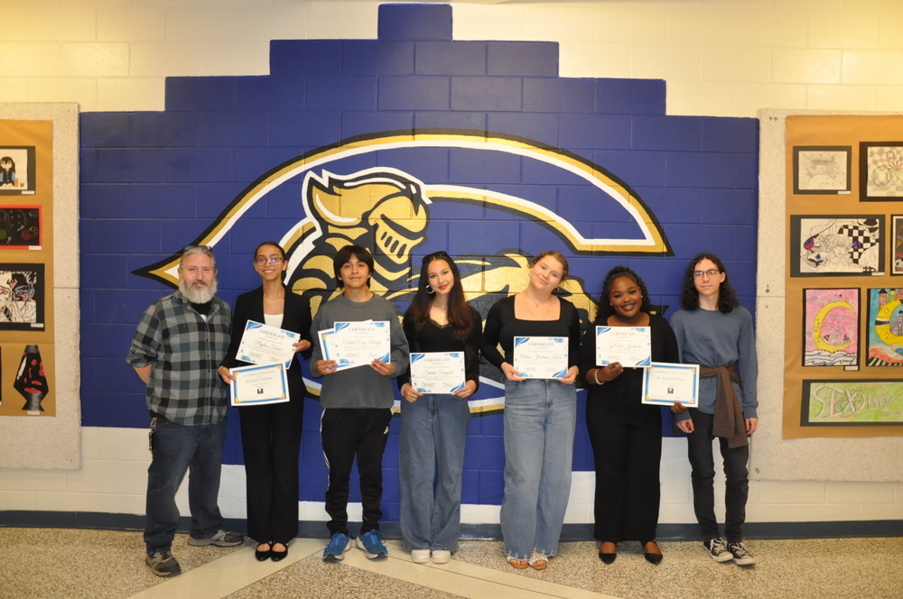 Members of the speech team who were present and recognized at the School Board meeting included Charles Haigh (coach), Peyton Turner, Victor Cruz-Araujo, Sarah Sargent, Alana Jackson-Lewis, and Joseph Haigh (Manager).