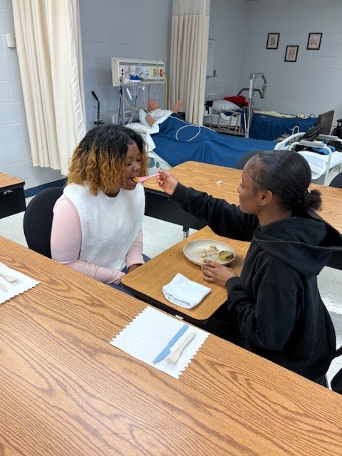 Nursing student feeds culinary Arts students 12
