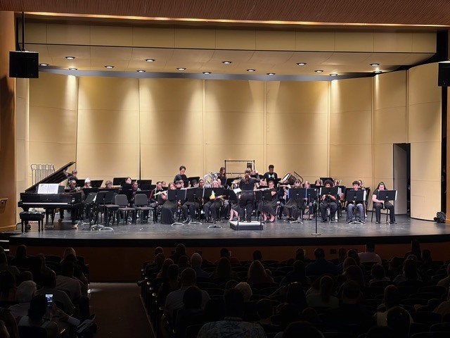 Band students perform on stage.