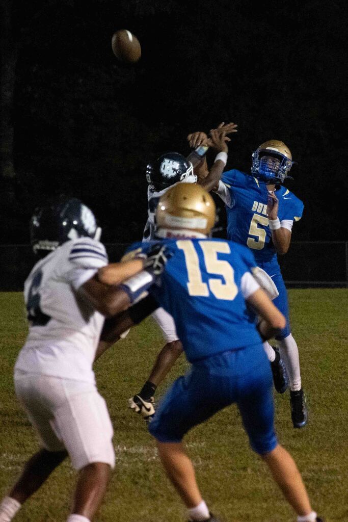 The QB passes to his receiver.