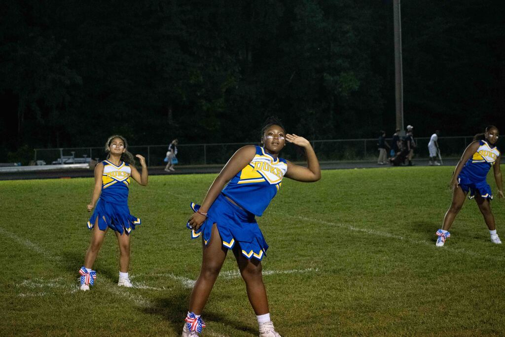 The cheer squad performs at half time.