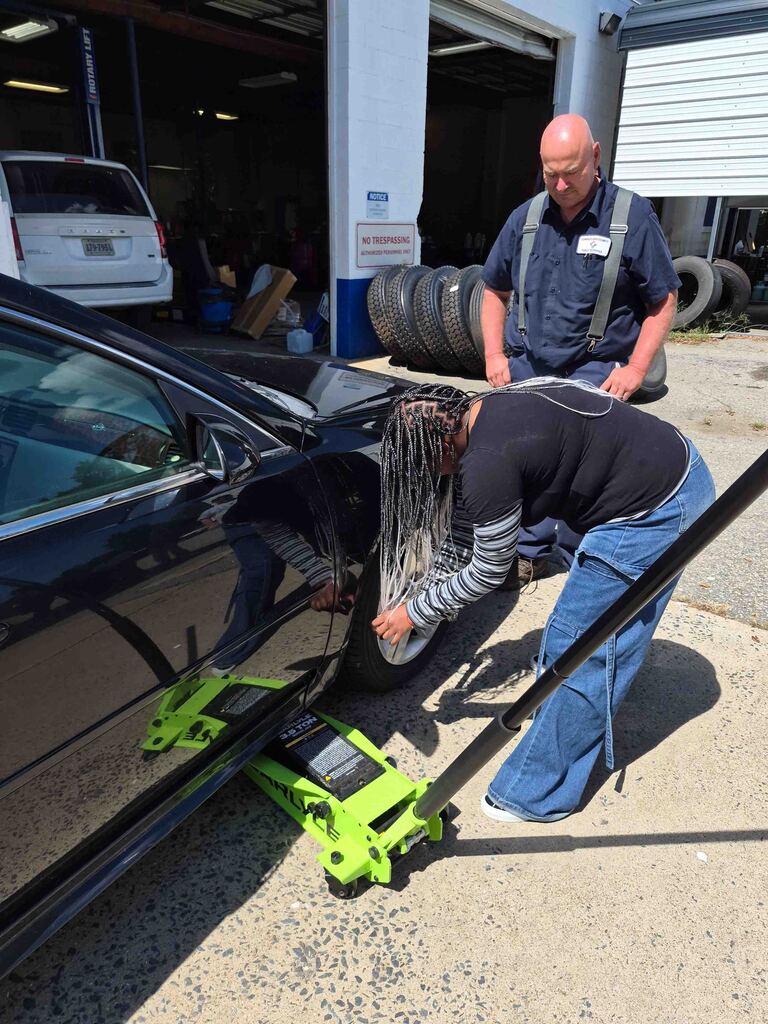 Mrs. Wrenn's students learn to change a tire.