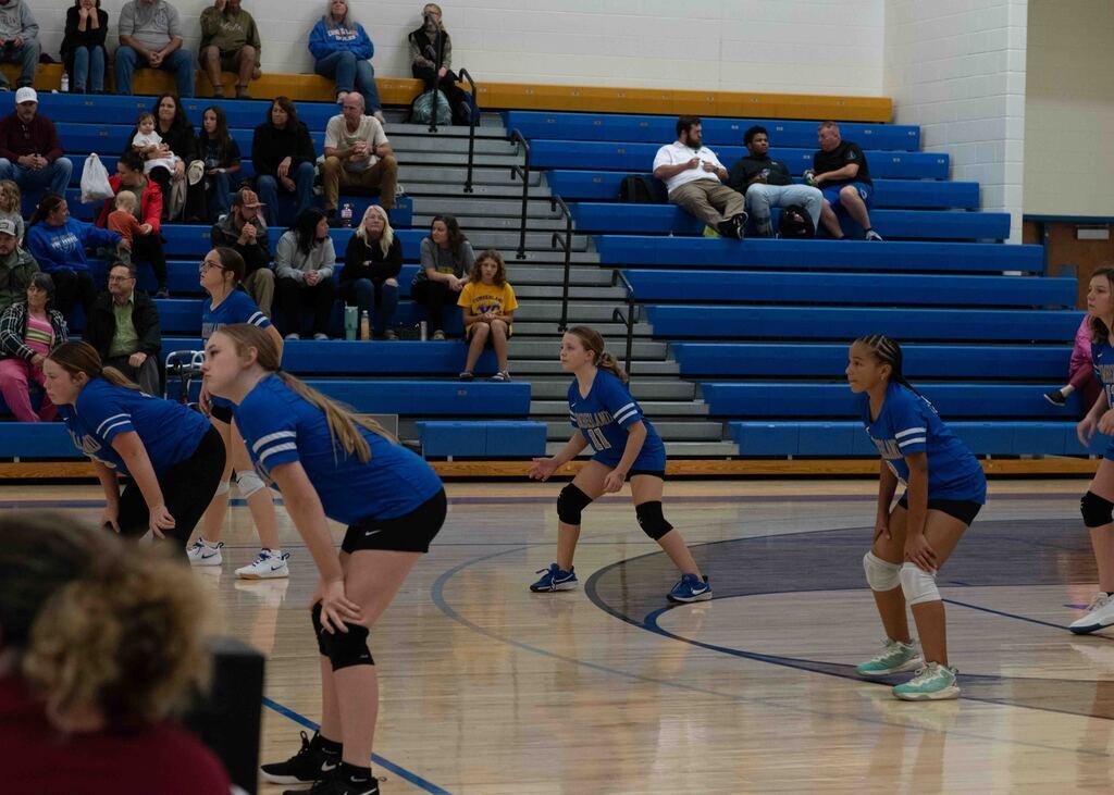 Players are ready for the next serve.