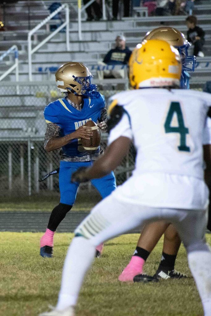 The Dukes QB readies a pass.