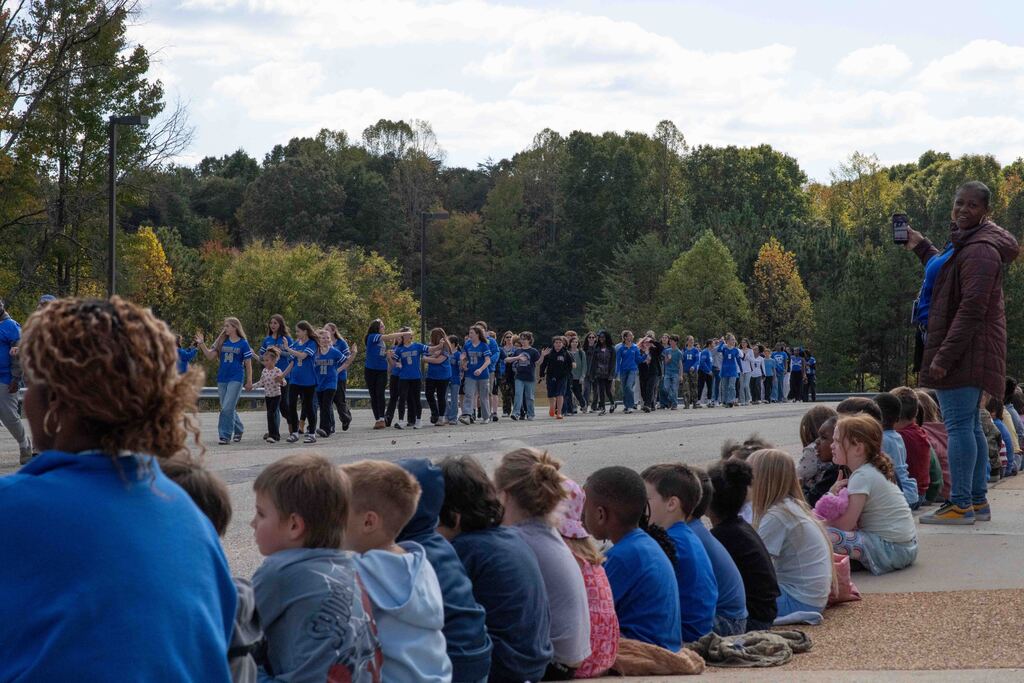 CES students watch the parade pass their school.