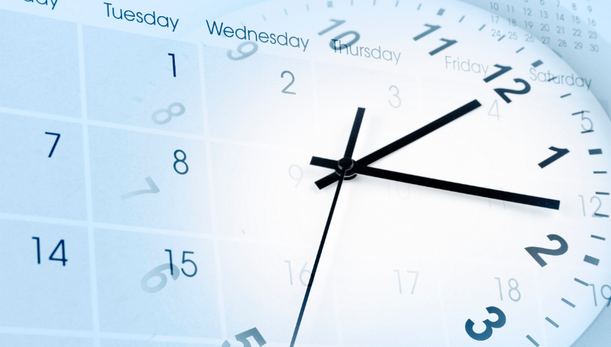 Image of an analog clock and calendar overlapped