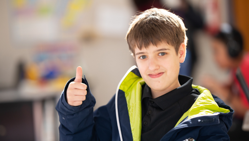 boy with thumbs up