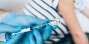 Syringe and vaccine